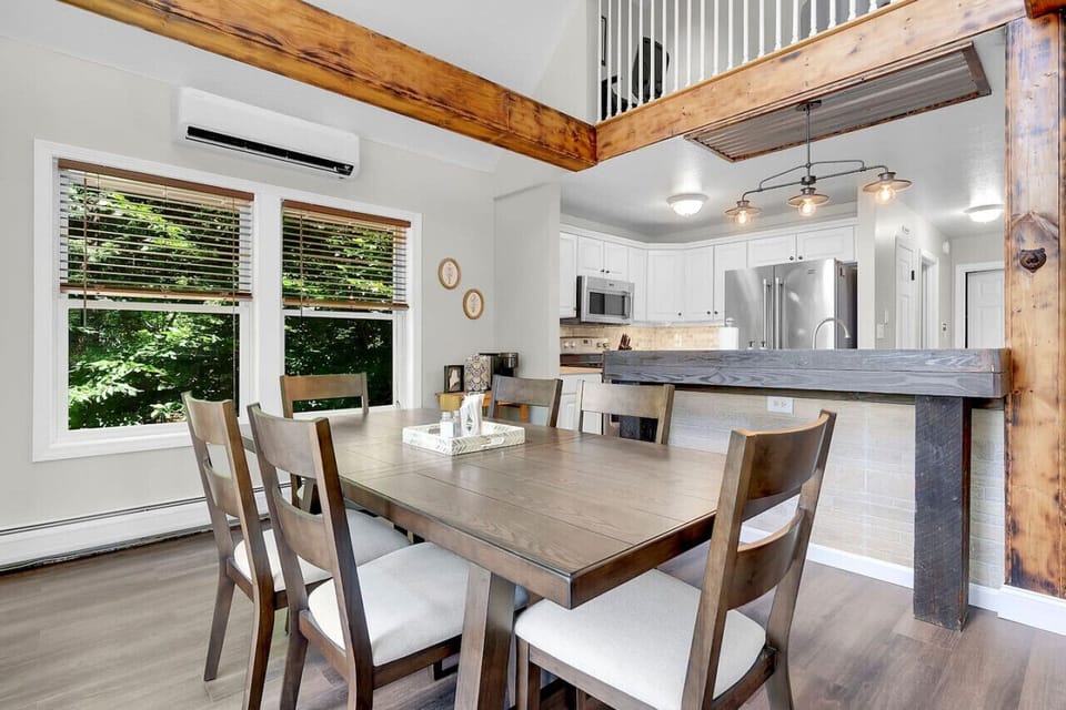 Dining table with seating for six located off the kitchen & living room.