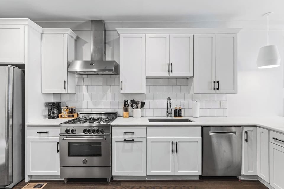 High-end appliances and all the cooking supplies you might need in this fully equipped kitchen with seating for three at the counter.