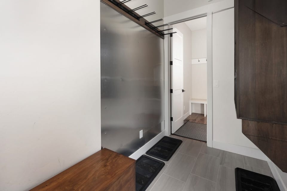 Ski valet room for ski gear storage. Guests enter the home through this room.