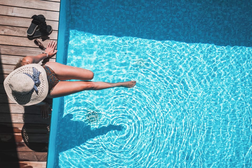 Seasonal outdoor pool, open 7:30 AM to 7:00 PM, pool umbrellas