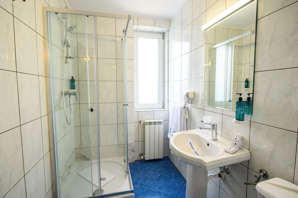Hair dryer, slippers, towels, soap