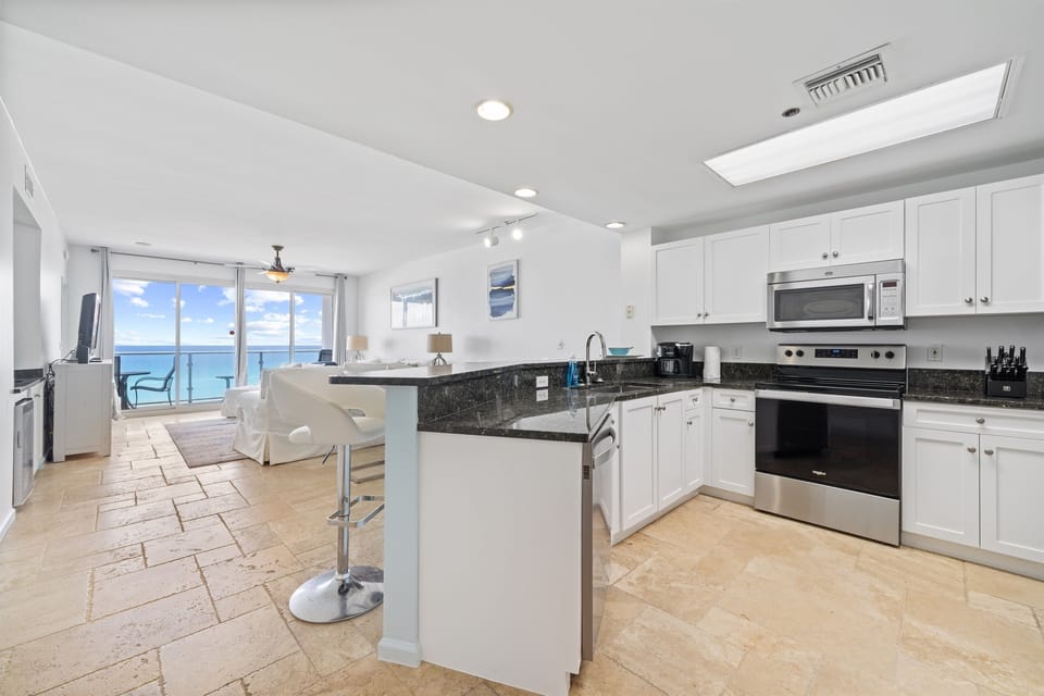 Gorgeous open concept kitchen with all cooking supplies included