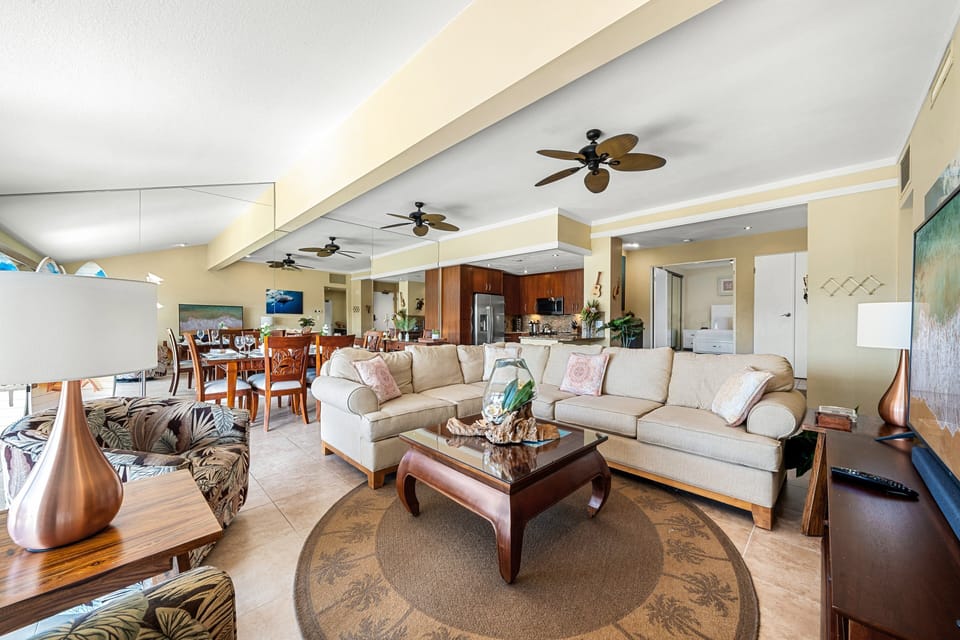 Spacious dining and living areas with ceiling fans and tropical decor, perfect for entertaining or family meals.