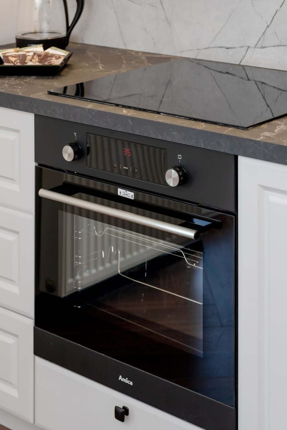 Oven Close-up – A close-up view of the oven built into the lower kitchen cabinetry.

