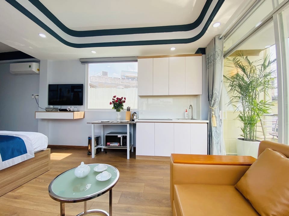 Deluxe Studio, Balcony, City View | Desk, laptop workspace, iron/ironing board, free WiFi