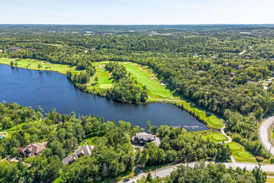 Scenic Retreat: Enjoy breathtaking views of lush greens and tranquil waters right from your stay!