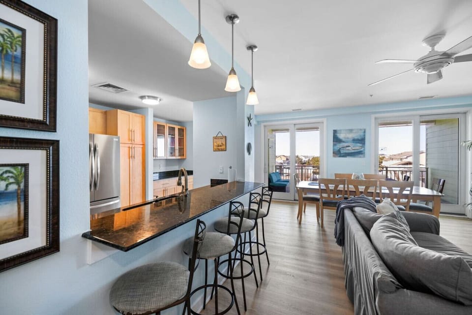 Experience the perfect balance of style and functionality with dining, living, and kitchen areas in one open space.