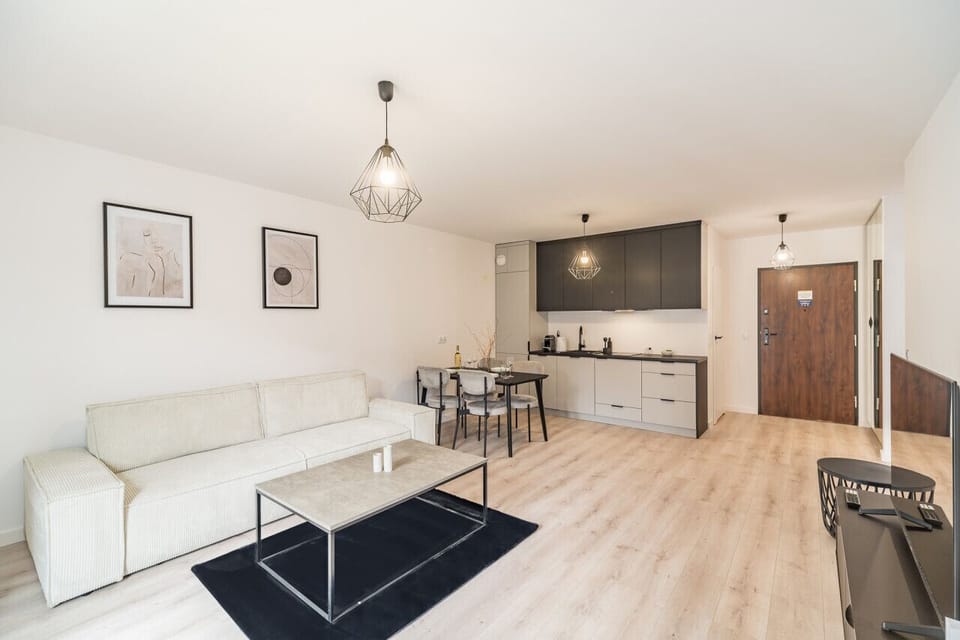 Comfortable Living Room with Sofa Bed and Smart TV | Book Now with RENTUJEMY