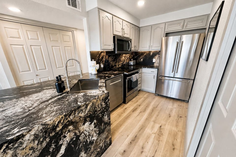 Well appointed, full granite kitchen with stainless appliances, ice maker, and f
