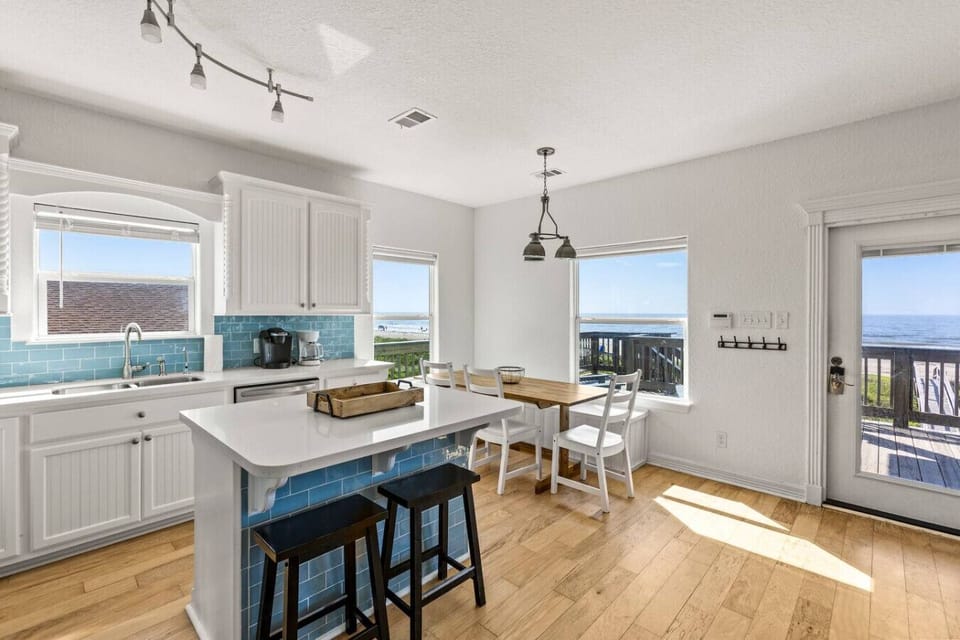 A bright and fully-equipped kitchen with stunning ocean views—perfect for cooking and gathering.