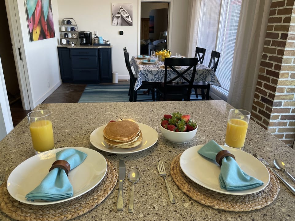 Gather around your inviting dining table, set for you with thoughtful details and fresh touches—perfect for shared meals, morning coffee, and easy conversation.