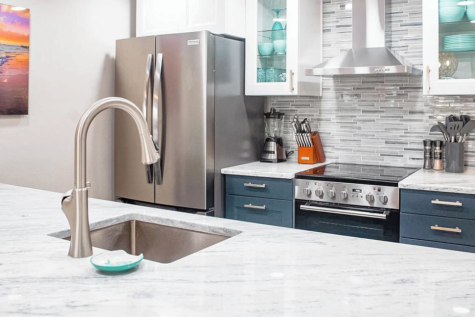 Gourmet kitchen with high-end appliances and a stylish backsplash
