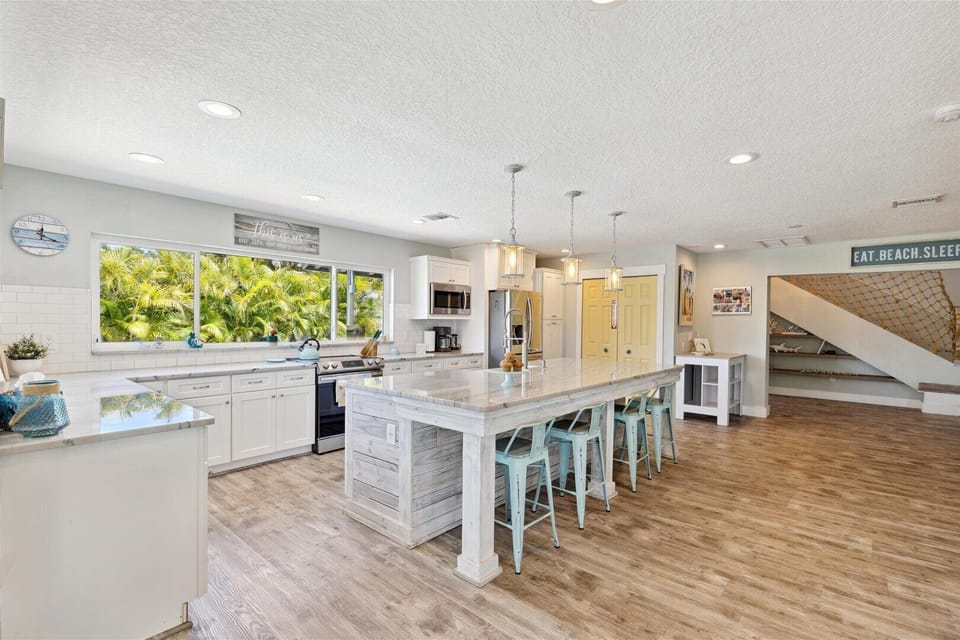 Cook in a bright, coastal-inspired kitchen with airy vibes!