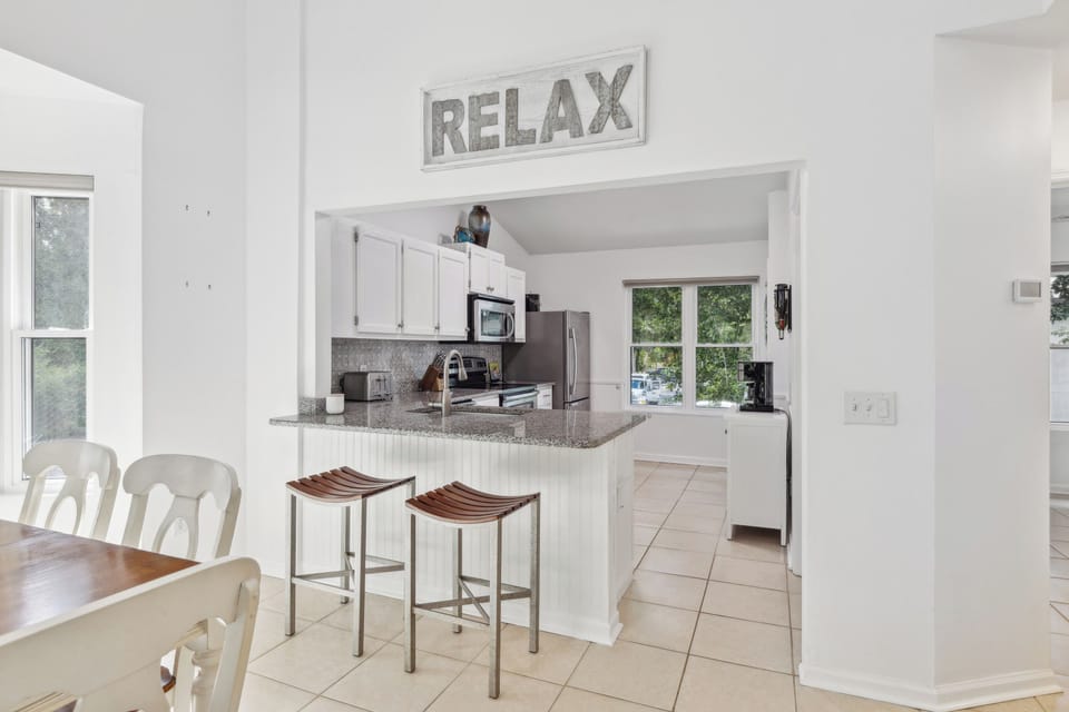 To your right from the entrance, a fully-equipped kitchen awaits, simplifying meal preparation.