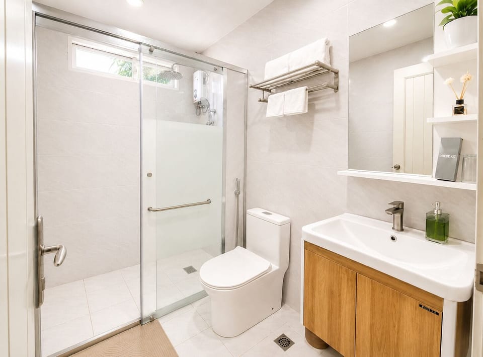 Shower, rainfall showerhead, bidet, towels