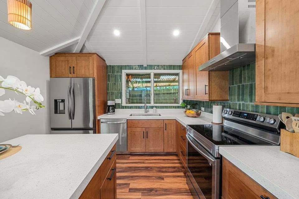 Fully furnished kitchen with stainless steel appliances and spacious counter