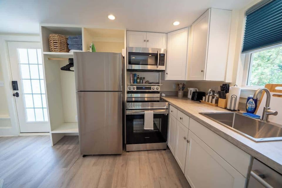 Modern kitchen with stainless steel appliances and open layout