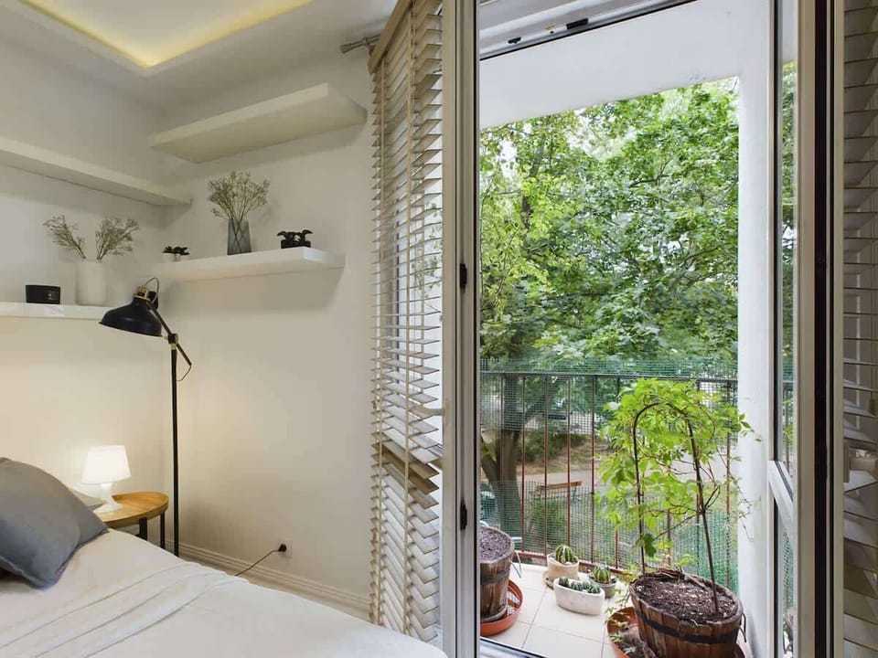 Living area with an access to the balcony.