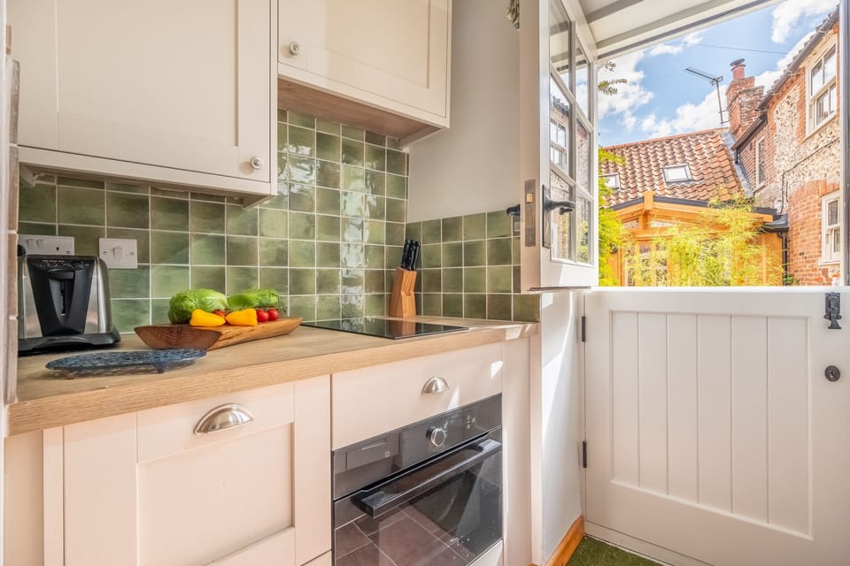 Ground floor: Enter the cottage into the kitchen with a barn door