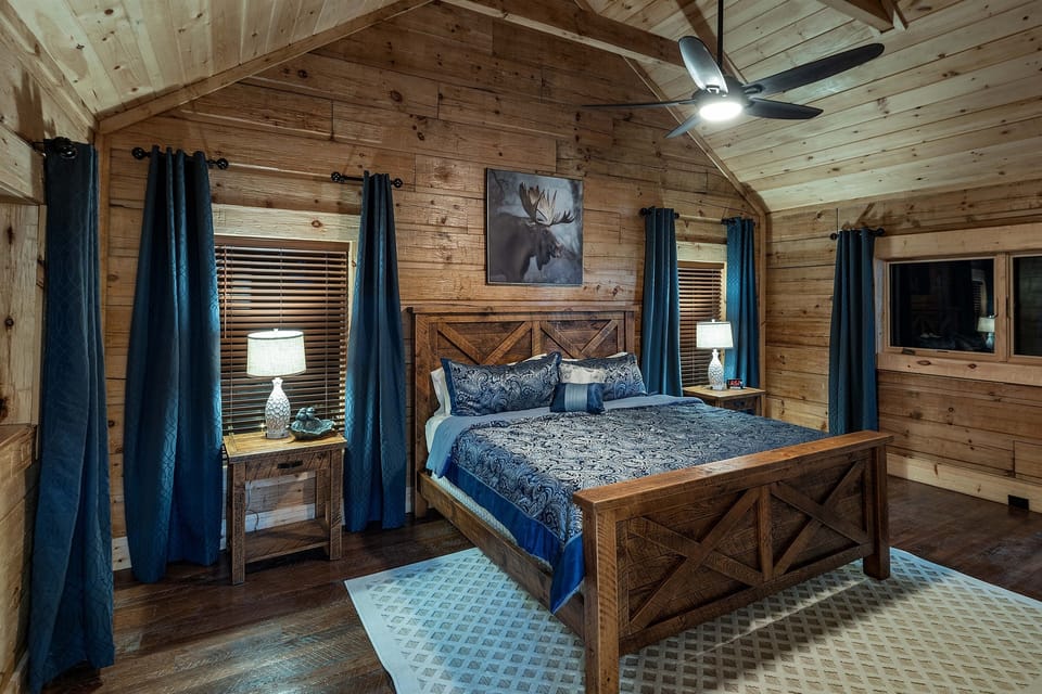 Here's another bedroom from the second-floor that offers a luxurious retreat with a king size bed, full en-suite bathroom where you can relax and enjoy the serene mountain view from the windows.