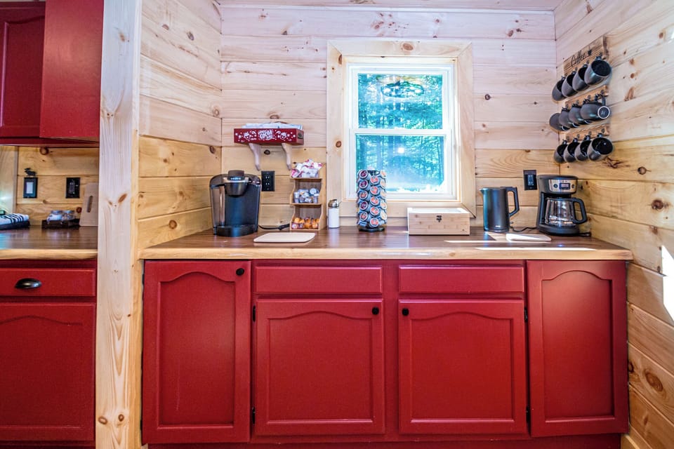 Kuerig, drip coffee maker, kettle, k-cups, tea, hot chocolate, and creamer.