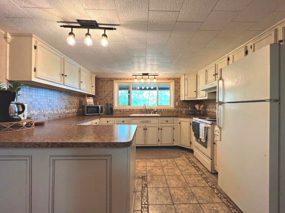 Beautiful, up to date kitchen. It's fully-stocked and perfect for any chef in the group to enjoy cooking any meal!
