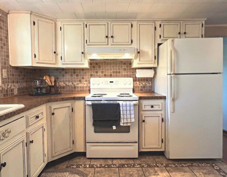 Beautiful, up-to-date kitchen. It's fully-stocked and perfect for any chef in the group to enjoy cooking any meal!