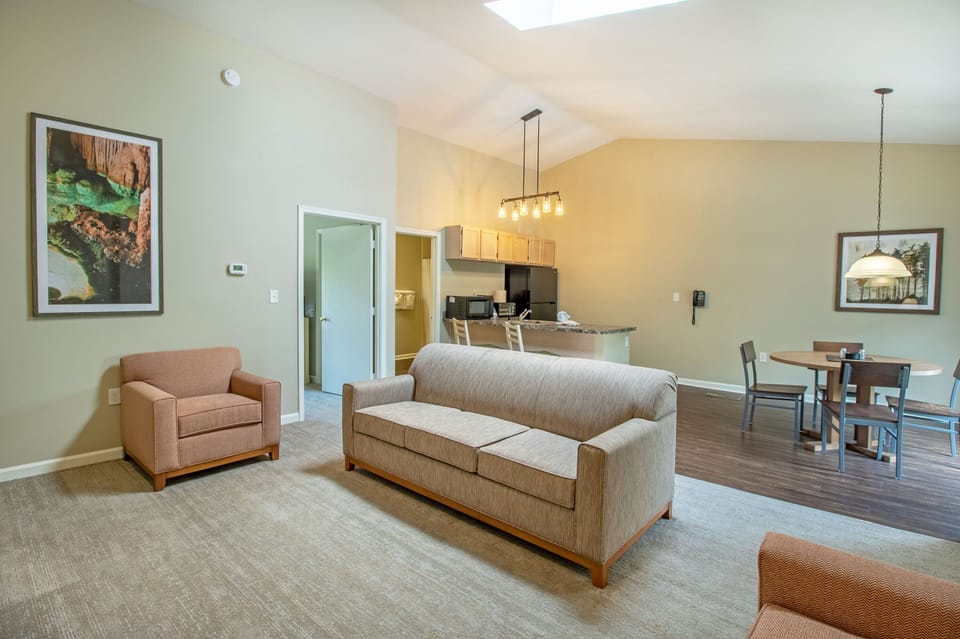 Living area with one sleep sofa, television, and fireplace