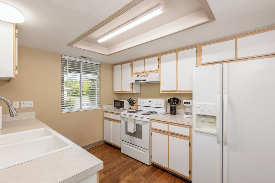 Open Space Kitchen With Washer and Dryer Off To The Side