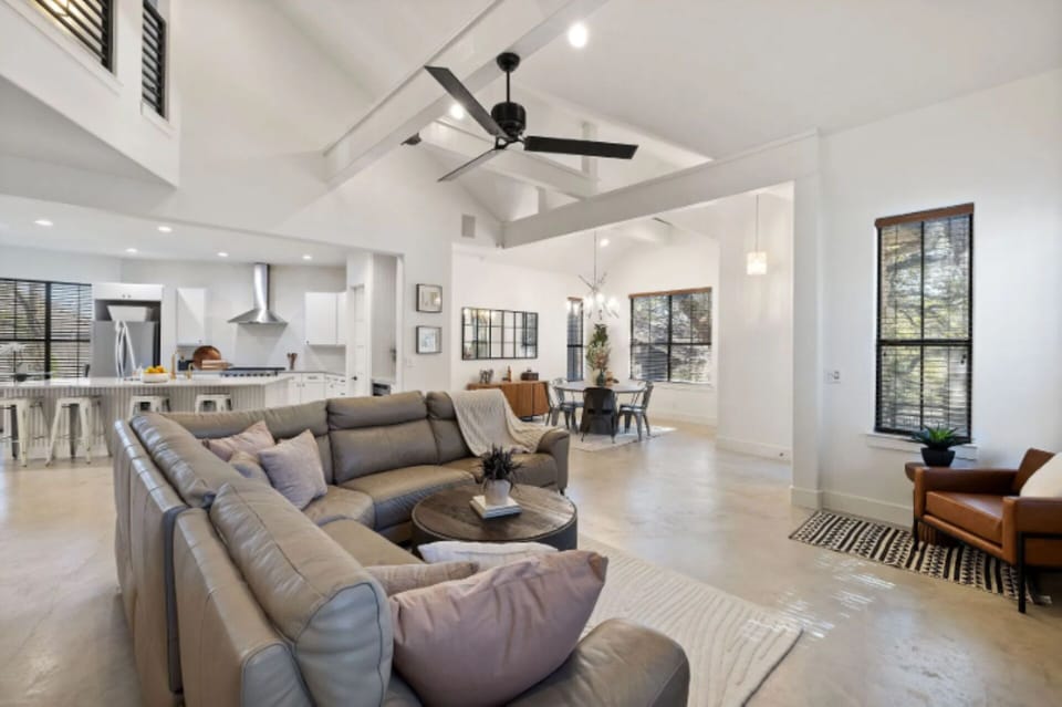 Living room open to kitchen and dining for seamless entertaining. 