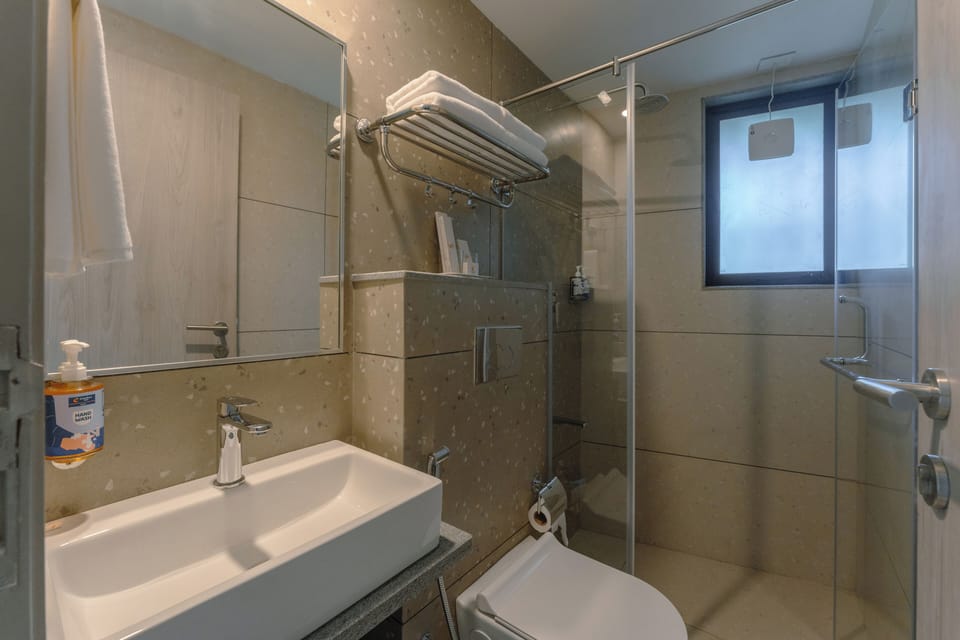 Shower, slippers, towels, soap