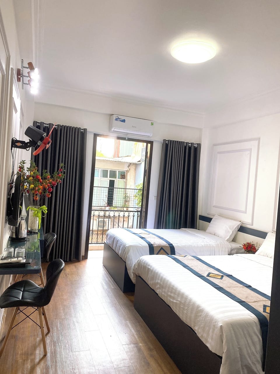 Deluxe Triple Room, City View | Desk, laptop workspace, free WiFi