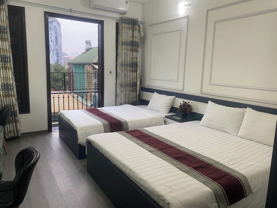 Deluxe Triple Room, City View | Desk, laptop workspace, free WiFi