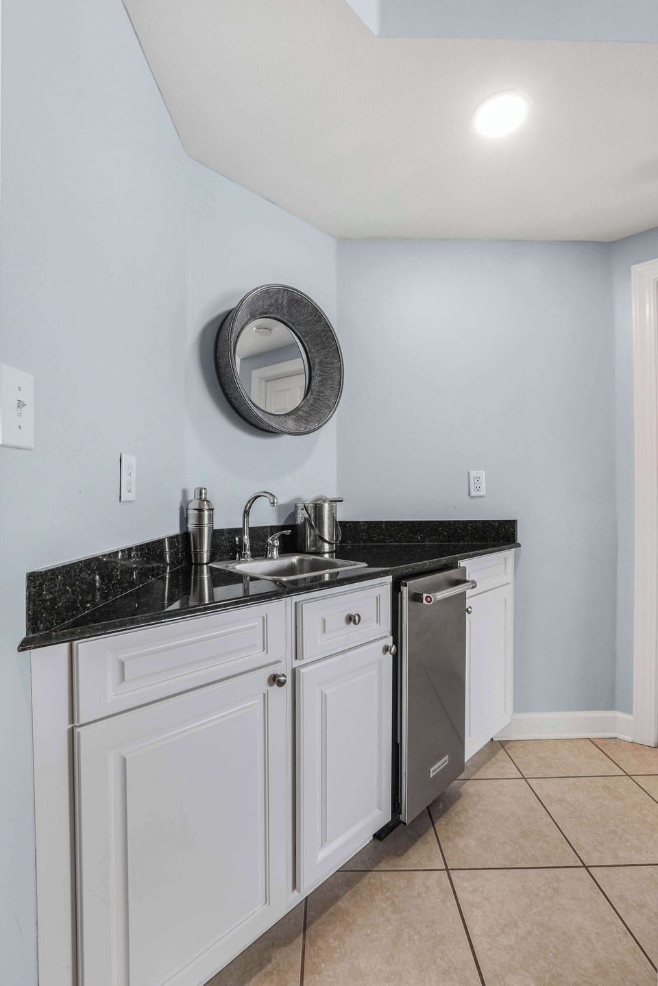 Wet bar with an additional ice maker.