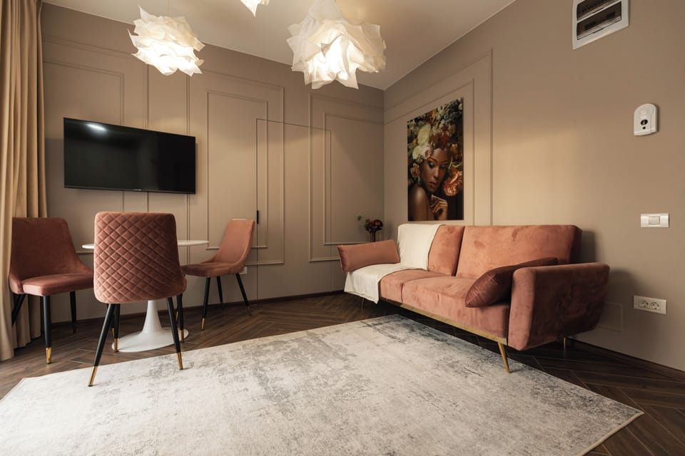 Deluxe Apartment, Balcony | Living area | Flat-screen TV