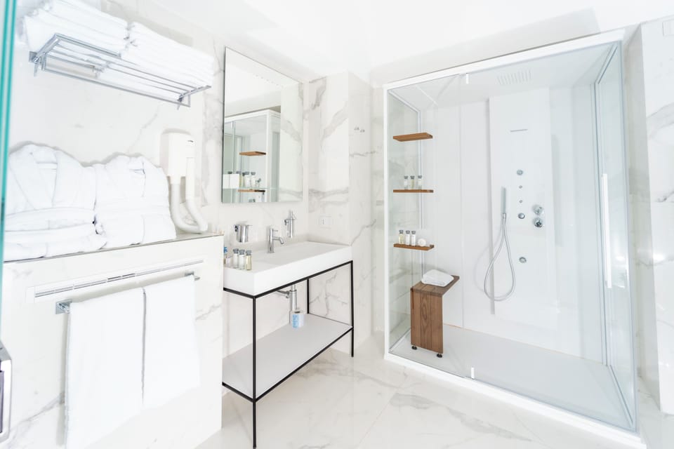 Luxury Suite, 1 King Bed, Terrace, Sea View | Bathroom | Hair dryer, bathrobes, slippers, bidet