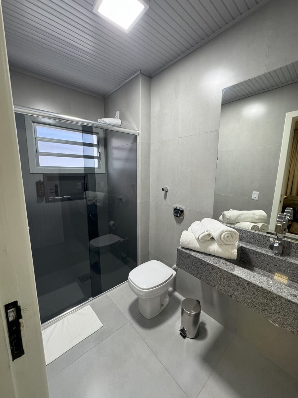 Shower, towels, soap, toilet paper