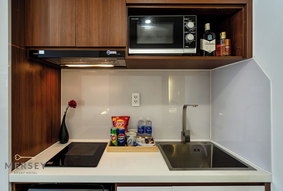 Mini-fridge, microwave, cookware/dishes/utensils, cleaning supplies
