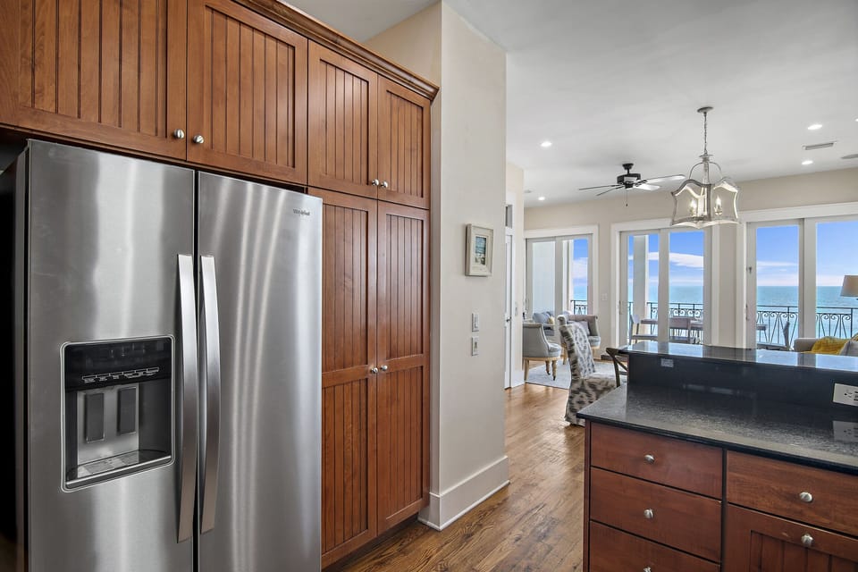 Remodeled Kitchen with granite countertops, stainless appliances - cook delicious meals and dine while overlooking the Gulf of Mexico!