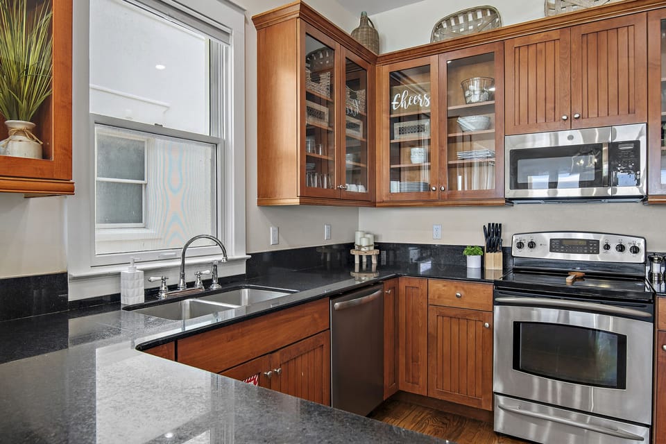 Remodeled Kitchen with granite countertops, stainless appliances - cook delicious meals and dine while overlooking the Gulf of Mexico!