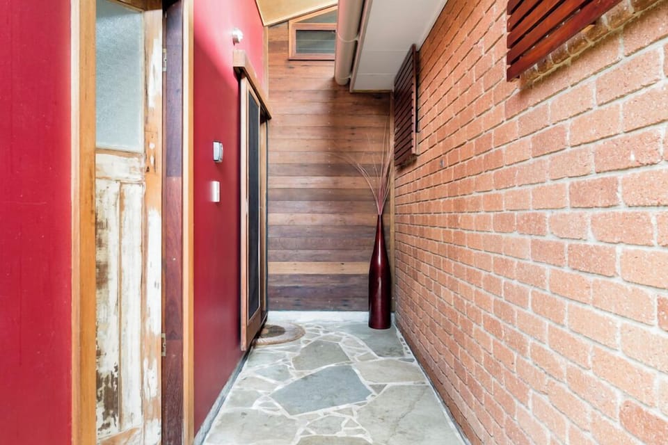 Bathroom access: Entry is via a separate door directly beside the front door of the studio.