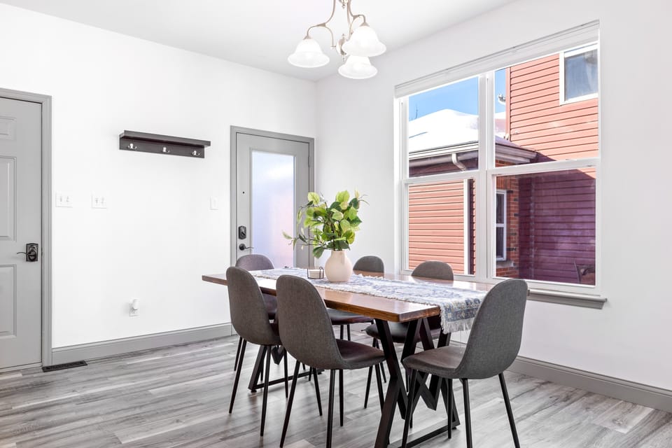 The dedicated dining area seats six beside large windows and the rear entrance.