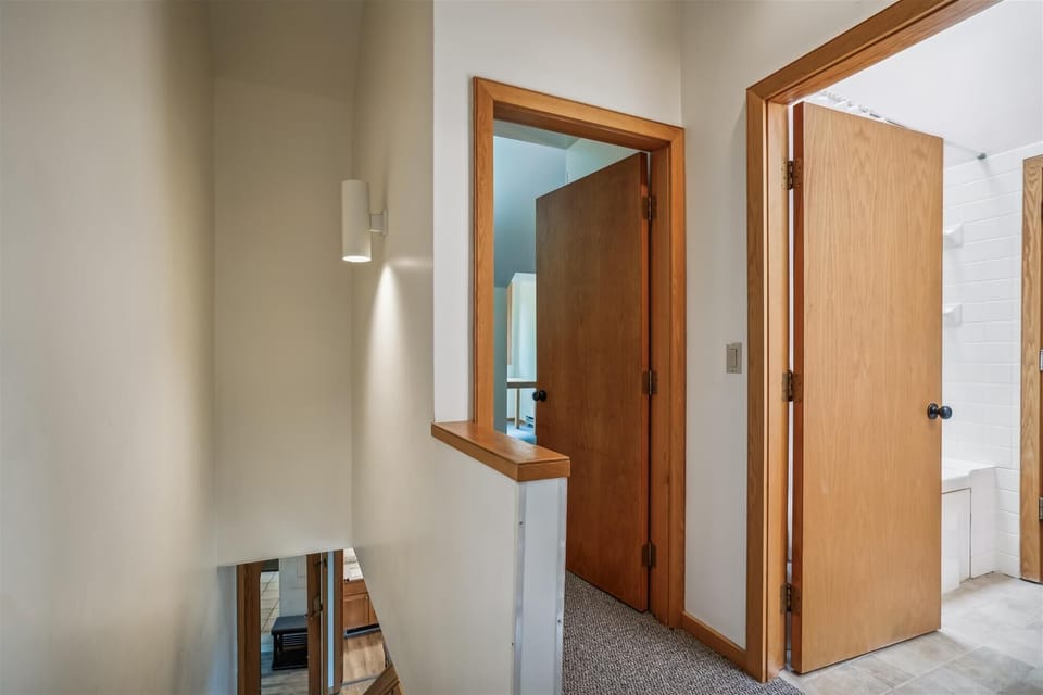 Easy access to upstairs bedrooms and bathrooms with an open loft-style layout.