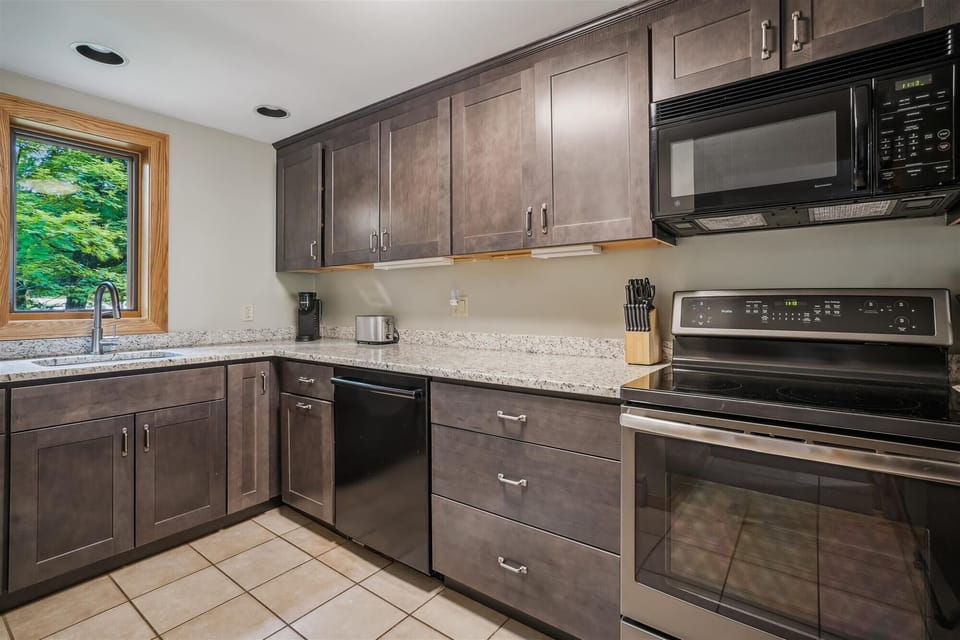 Well-equipped kitchen featuring updated cabinetry, stainless appliances, and plenty of prep space.