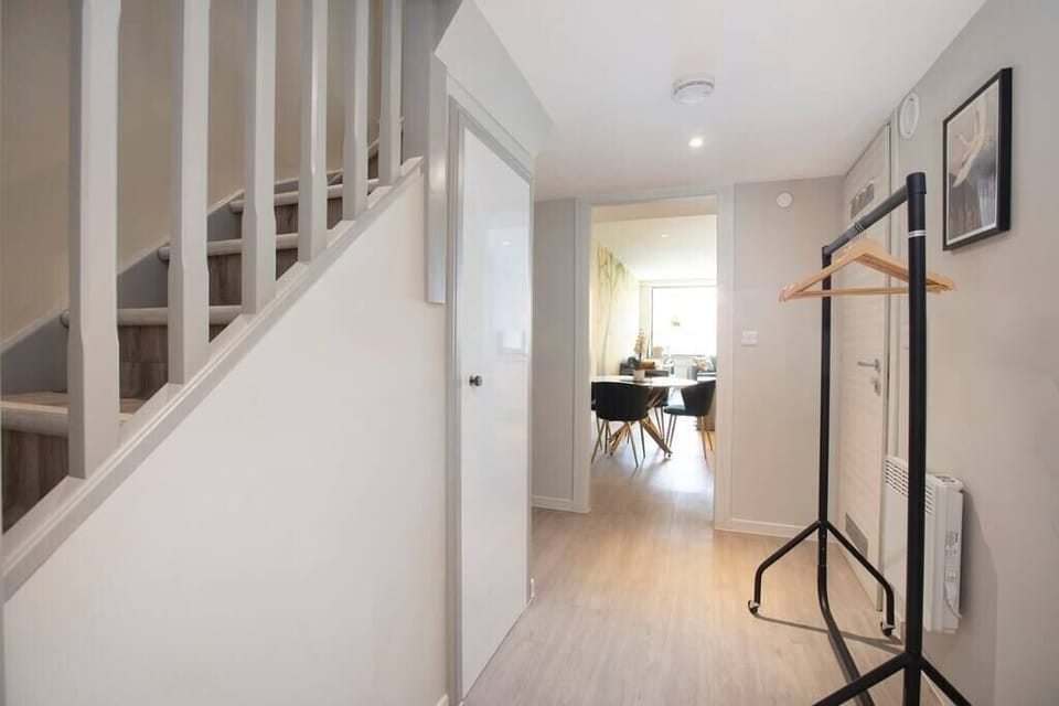 Integrated living, bedroom, and kitchen spaces in an open layout.