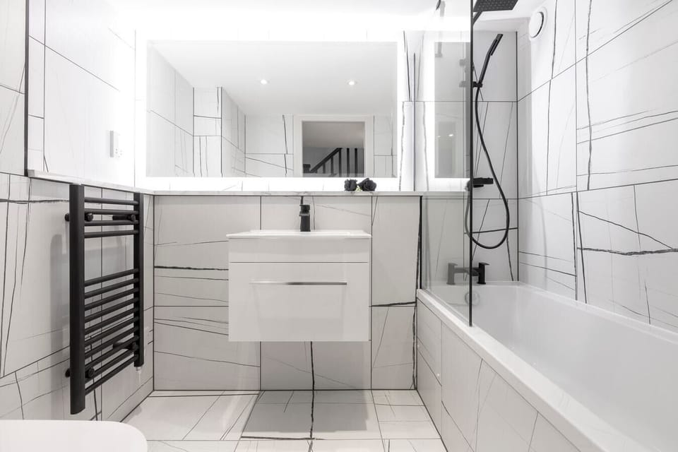 Bathroom with shower over bath.