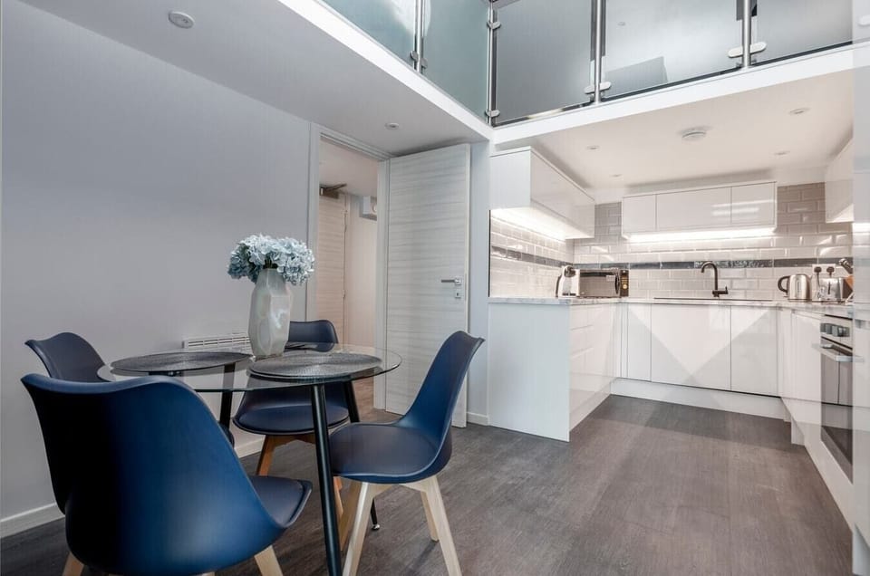 Integrated living, bedroom, and kitchen spaces in an open layout.