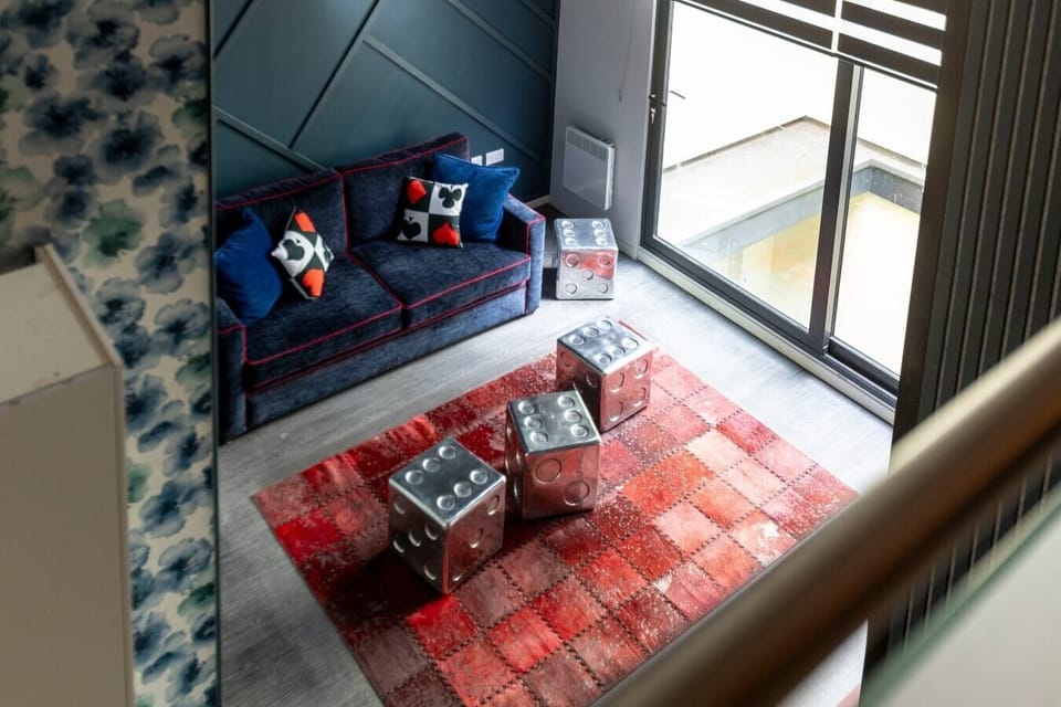 Integrated living, bedroom, and kitchen spaces in an open layout.