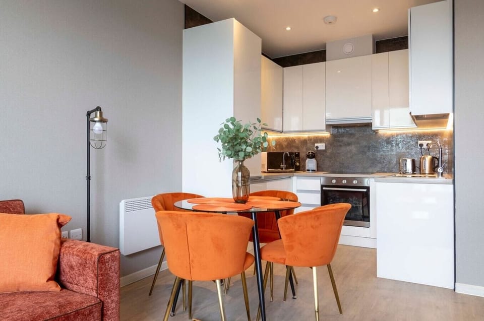 Integrated living and kitchen spaces in an open layout with direct access to a private terrace.