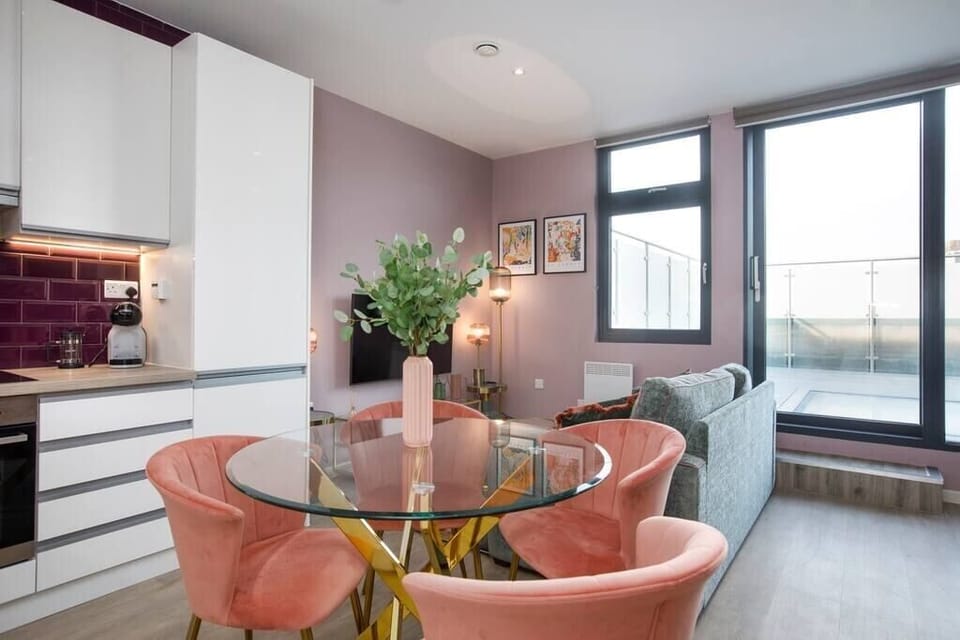 Integrated living, bedroom, and kitchen spaces in an open layout.
